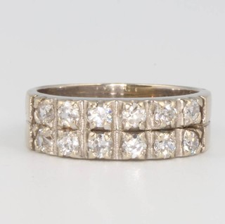 An 18ct white gold 12 stone diamond half hoop ring, 5.3 grams, size K