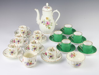 A Grosvenor china part coffee set comprising 5 coffee cans and 5 saucers, together with a Royal Worcester Roanoke part coffee set - 6 coffee cups, 6 saucers, milk jug, sugar bowl and coffee pot 