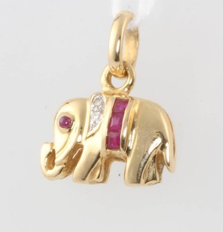 An 18ct yellow gold diamond and ruby elephant pendant 1.6 grams 