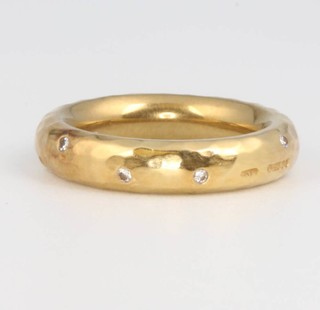 An 18ct yellow gold diamond set band 8.4 grams, size G 