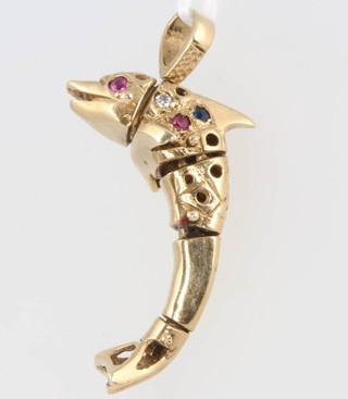 A 9ct yellow gold gem set articulated dolphin pendant 6.7 grams