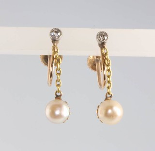 A pair of 9ct yellow gold pearl and diamond earrings 1.6 grams