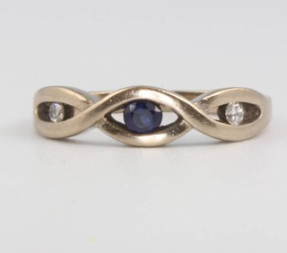 An 18ct white gold sapphire and diamond ring size J, 3.1 grams