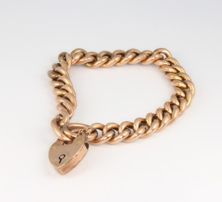 A 9ct yellow gold curb link bracelet with padlock 17.1 grams 
