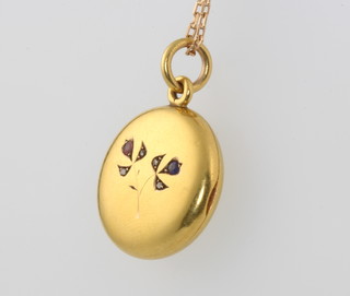 A yellow gold gem set circular locket and chain, gross 10.5 grams