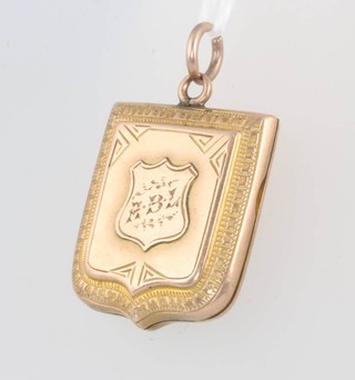 A 9ct yellow gold shield shaped locket, 4 grams 