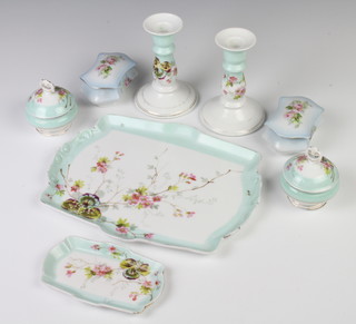 An Edwardian dressing table set comprising tray, pair of candlesticks, 2 boxes and a pin tray together with 2 other boxes