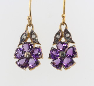 A pair of silver gilt amethyst and diamond floral earrings 