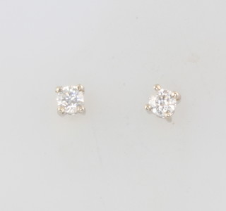 A pair of 18ct white gold single stone diamond ear studs approx. 0.3ct, 