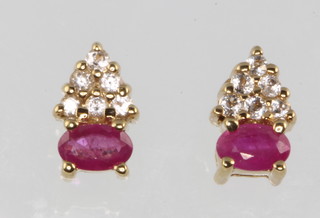 A pair of 9ct yellow gold ruby and diamond ear studs 1.7 grams