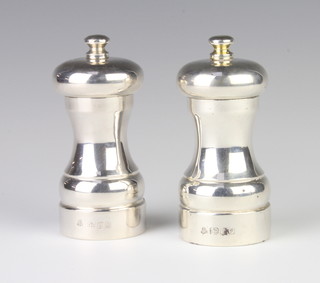 A pair of silver salt and pepper mills, London 1990 10cm 