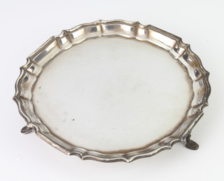 A silver card tray with Chippendale rim on hoof feet, Sheffield 1937, 16cm, 169 grams 