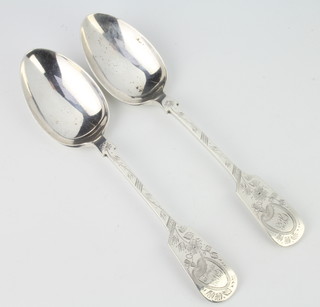 A pair of silver table spoons with engraved decoration, Sheffield 1917, 219 grams 