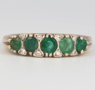 A 9ct yellow gold emerald and diamond ring, size O, 2.2 grams