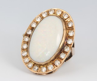 A 9ct yellow gold opal and paste set dress ring, size Q, 35mm x 30mm 