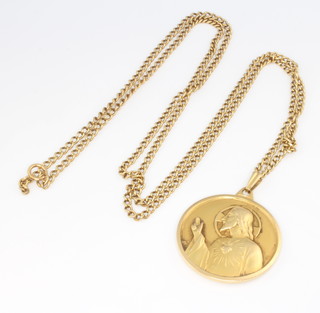 An 18ct yellow gold repousse pendant and chain, 21 grams 