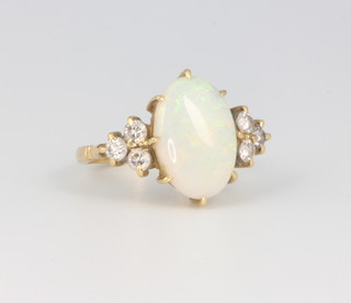 An 18ct yellow gold opal and diamond ring, size M, the opal 15mm x 10mm, the diamonds approx. 0.6ct 