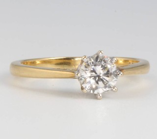 An 18ct yellow gold brilliant cut single stone diamond ring, approx 0.75ct, size O 