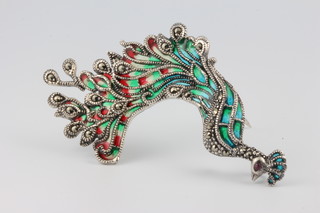 A silver and enamelled peacock brooch 65mm x 38mm 