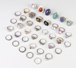 A dress ring size M and a quantity of other silver dress rings