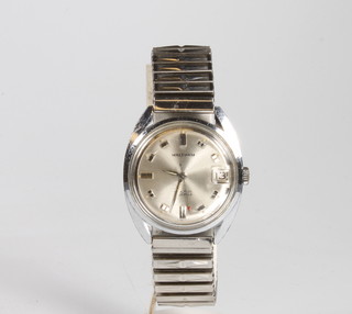 A gentleman's steel cased Waltham wristwatch with calendar dial on an expanding bracelet 