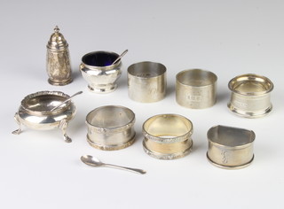A silver Arts & Crafts style napkin ring Birmingham 1952, 5 others and 3 condiments with 3 spoons 280 grams 