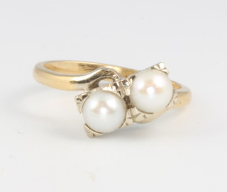 A 14ct yellow gold double pearl cross-over ring size M 