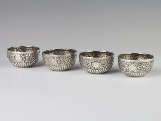 A set of 4 Victorian repousse silver circular table salts Sheffield 1882, 118 grams