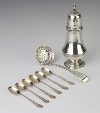 A silver sugar shaker Birmingham 1938, a sifter spoon and 6 teaspoons 232 grams