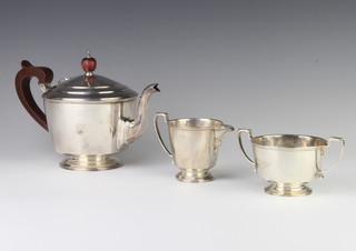 An Art Deco 3 piece silver tea set with fruitwood mounts Birmingham 1932, 1933, gross 826 grams 