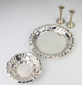 A Continental silver circular dish 21cm, a smaller ditto and 2 candlesticks 320 grams  