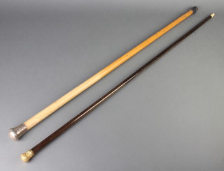A 19th Century walking cane with 18ct yellow gold repousse knop and ivory tip, a silver mounted ditto 