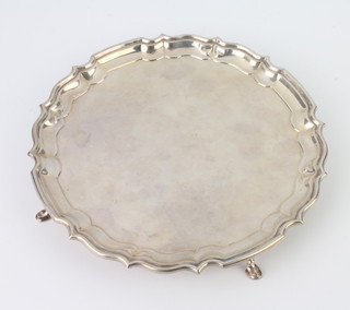 A silver card tray with Chippendale rim and hoof feet, Birmingham 1936, 20cm, 352 grams