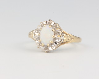 A 9ct yellow gold open diamond oval cluster ring size L, 2 grams