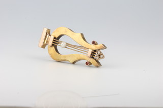 A 15ct yellow gold pearl and ruby set lyre brooch, 5.5 grams