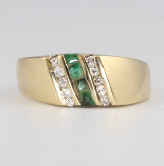 A 14ct yellow gold emerald and diamond cocktail ring, 3.6 grams, size J 1/2