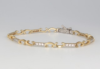 A 14ct yellow gold diamond set open scroll bracelet 8.2 grams, 18cm 