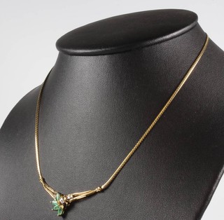 A 9ct yellow gold emerald and diamond spray necklace 6.4 grams