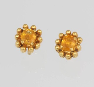 A pair of 18ct yellow gold gem set ear studs, 2.1 grams 