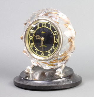 Majak, a Soviet Russian mantel timepiece with silvered dial and Arabic numerals contained in a moulded glass and Bakelite case 