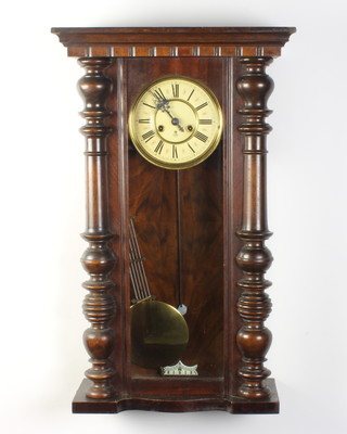 Gustav Becker, a Vienna style regulator with paper dial and Roman numerals, having a gridiron pendulum and contained in a walnut case