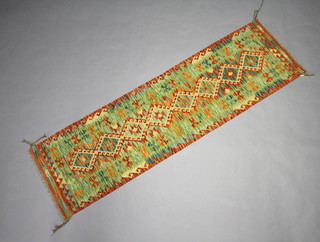 A turquoise, tan and yellow ground wool Chobi Kilim runner with 8 diamonds to the centre 208cm x 67cm 