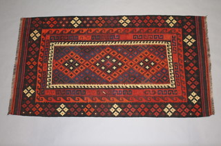 A red, blue and white ground Ghalmori Kilim with 3 stylised diamonds to the centre within a multi row border 200cm x 110cm 