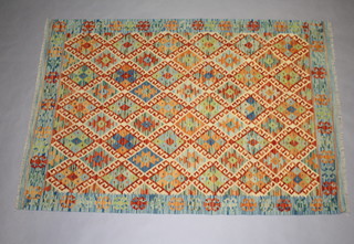 A turquoise, tan and green ground wood Chobi Kilim rug 184cm x 127cm 