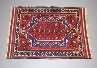A blue, red and white ground Gulbarjasta Kilim with central medallion within a multi row border 186cm x 137cm 