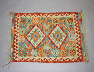 A yellow and green ground wool Chobi Kilim rug with 2 diamonds to the centre 120cm x 79cm  