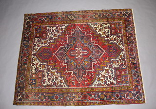 A red, white and blue ground Persian Heriz carpet 257cm x 214cm 