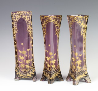 A pair of Art Nouveau amethyst glass gilt decorated vases 29cm, a triangular ditto 28cm 