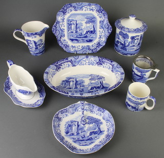 A modern Spode Italian dinner, tea and coffee service comprising 12 mugs, 2 tea cups, 8 small plates, 4 medium plates, 6 dinner plates, sandwich plate, 6 dessert bowls, 6 soup bowls, a trefoil dish, biscuit barrel and cover, measuring jug, sauce boat and stand, an oval pie dish anda  commemorative plate 