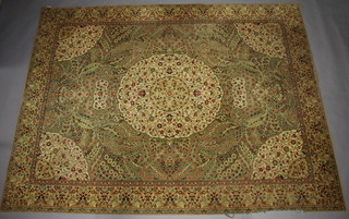 A green and floral patterned Persian style machine made carpet with central medallion 367cm x 275cm 